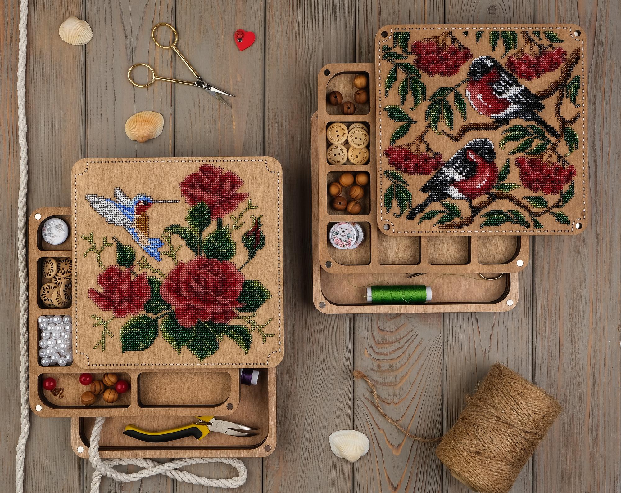 Boxed embroidery kit on dark surface